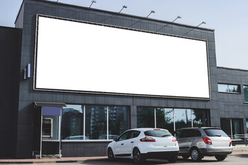 Obraz premium Blank long white billboard or screen mockup on building wall.