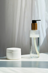 cosmetics in jars on the table in the sunlight. The natural setting of real life