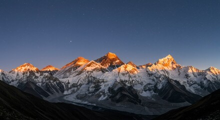 Fototapeta premium Majestic snow-capped peaks at dawn