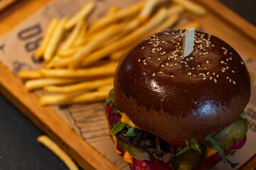 Closeup of hamburger and fries served at restaurant