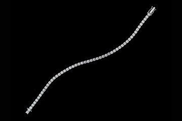 bracelet silver, gold with stone diamonds on black background