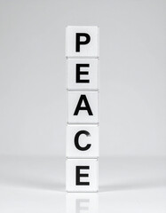 Children's building blocks spelling out the word "PEACE," symbolizing a foundational hope for a peaceful future built by new generations.