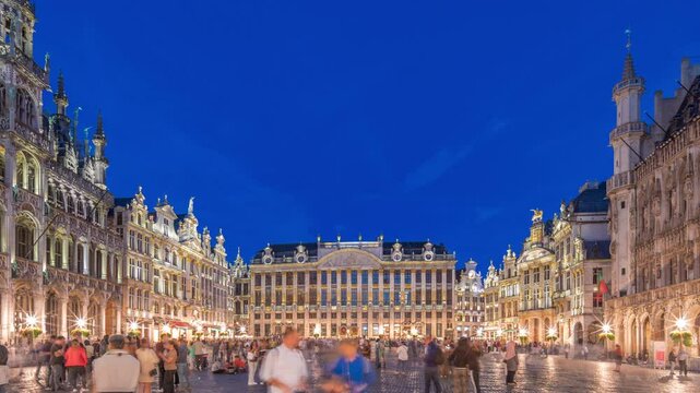 The Grand-Place (Grote Markt) day to night transition timelapse hyperlapse in Brussels, Belgium. Brabantine Gothic Town Hall, Maison Grand-Place and tourists in the historic city center after sunset