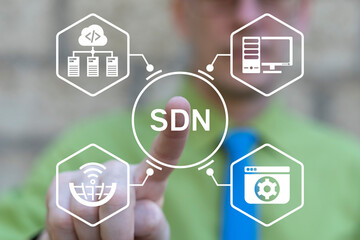 Concept of SDN Software Defined Networking. Developer using virtual touchscreen push abbreviation: SDN. Data transmission network virtualization using software.