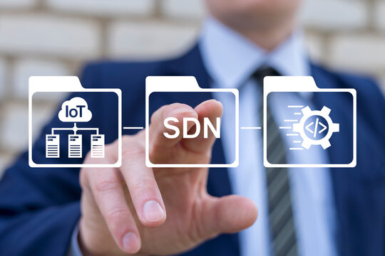 Concept of SDN Software Defined Networking. Person using virtual touch screen push abbreviation: SDN. Data transmission network virtualization using software.