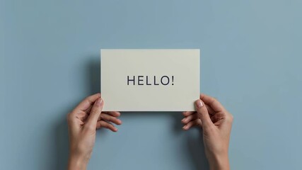 Woman holding white card with hello word. Invitation concept with greeting message for special occasion. Welcome banner for event and notification announcement