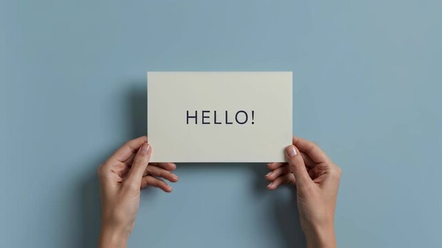 Woman holding white card with hello word. Invitation concept with greeting message for special occasion. Welcome banner for event and notification announcement