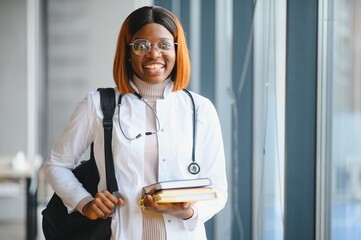 Medical Internship Concept. Portrait Of Young Black Female Doctor Student In White Coat
