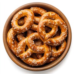 A wooden bowl filled with freshly baked pretzels sprinkled with coarse salt on a white background
