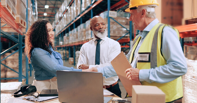 Business people, document and shaking hands in warehouse for logistics, meeting for supply chain collaboration. Import team, tech or handshake in storage for export deal, service agreement or welcome