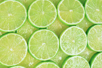 Fresh lime slices as a background.