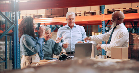 Distribution, people and celebration in warehouse, laptop and cooperation with achievement. Group, success and employees with pc, profit growth or B2B deal for product export, smile or delivery goals