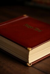 red book sitting on top of a wooden table