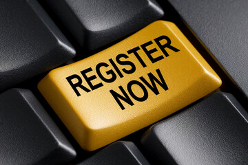 Close-up of gold keyboard button with "Register Now" text, set against black keys, representing online registration or call to action