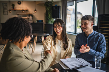 young japanese entrepreneur shake hands with financial adviser