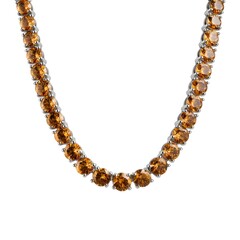 Obraz premium Indulge Luxury with a Polished Topaz Tennis Necklace Featuring Open Prong Gem Settings for Brilliance