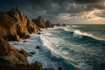 Obraz premium Rugged golden-brown cliffs and turbulent sea with crashing waves under overcast sky