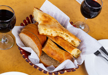 Image of delicious bread on the Georgian table, cut into pieces