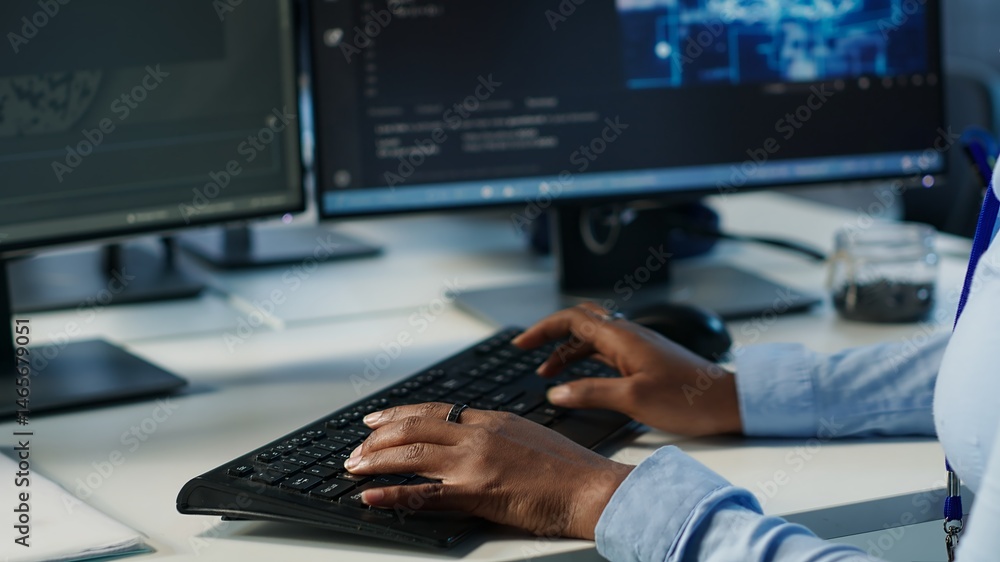 Poster data center admin using pc to find misconfigurations affecting rackmounts performance. person checki