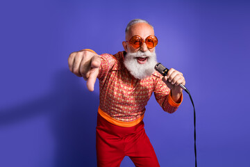 Eccentric elderly gentleman with vibrant retro outfit and microphone showcasing charismatic energy...
