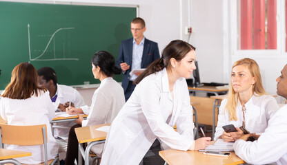 Students talking in the class of the medical academy