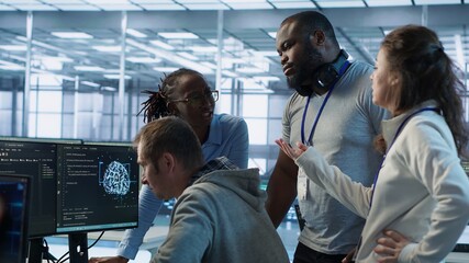 Engineer calling colleagues after finding error in code while doing checkup on server room used for AI workloads. Man requesting help from coworkers after finding bug in data center systems, camera A