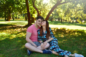 Happy Young Couple Smiling Together in Sunny Park