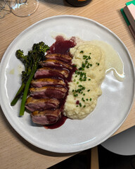 Duck breast with broccolini and mashed celeriac.