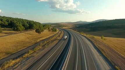Fototapeta premium Aerial view of empty twin-lane asphalt highway. 