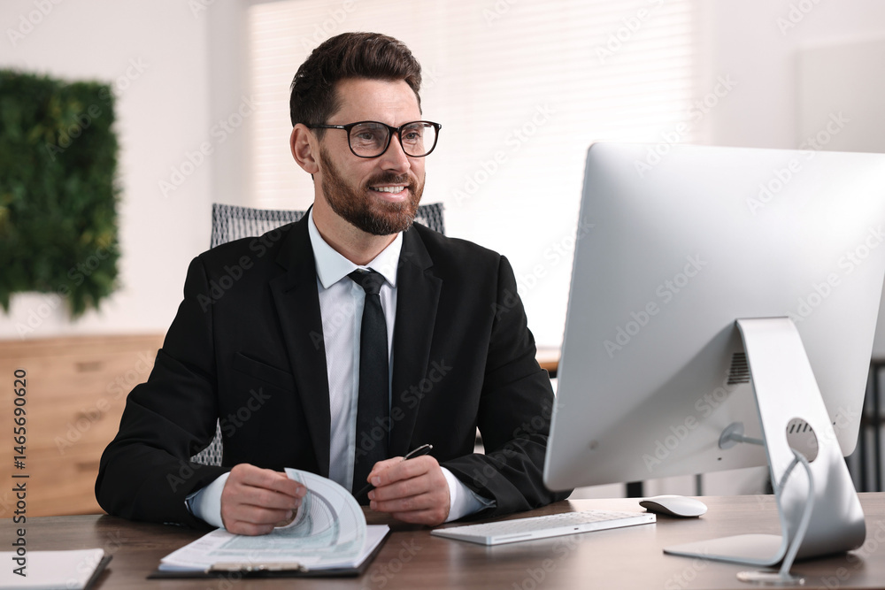 Poster man working with document at table in office