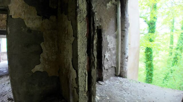 Crumbling walls and decaying interiors in the abandoned Sanatorium Savane Hotel illustrate the disrepair of a once-popular Soviet-era spa in Georgia