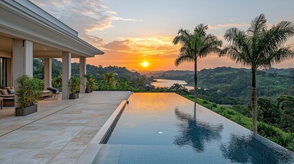 Luxury Villa Pool at Sunset Overlooking Tropical Landscape and Water