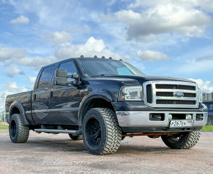 Ford F-350 4x4 black color parked on street. Exterior Ford F-350 SRW Crew Cab XL pickup off-road us vehicle. USA SUV Ford F-350 at the parking. American SUV cars. 