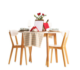 Served restaurant table with roses on white background