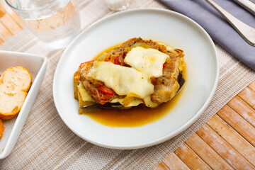 Just cooked eggplants with ground meat and cheese served on table.