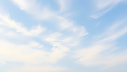 Fototapeta premium Serene Blue Sky with Wispy White Clouds A Peaceful Nature Background