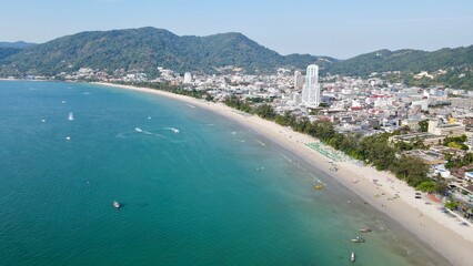Fototapeta premium Coastal cityscape with beach and mountains 