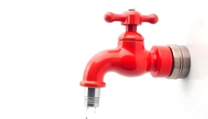 Vivid red faucet with silver accents against a white background symbolizing water conservation