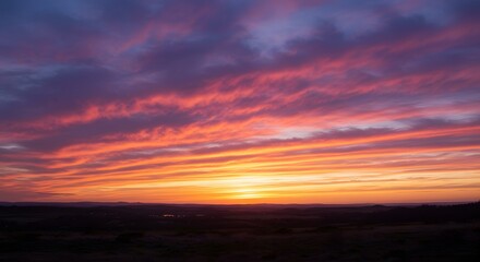 Fototapeta premium Vibrant Sunrise Over Horizon with Colorful Clouds and Sky