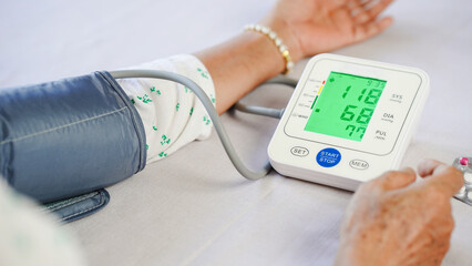 Blood pressure monitor, adult arm, digital display, medical device, healthcare, hospital, patient