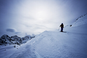 Skier coming down Piz Corvatsch mountain, Switzerland, Europe 