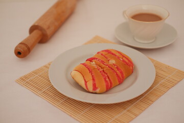 Sweet Pastry with Tea and Rolling Pin