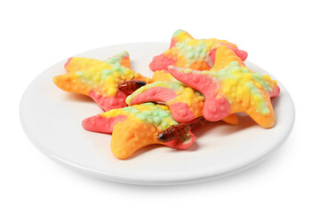Cockroaches crawling on gummy candies against white background