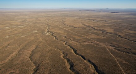 Aerial View of a Vast Brown Desert Landscape