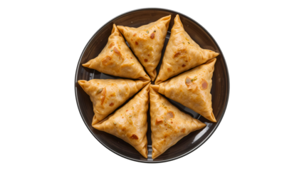 A top view of samosas arranged in a circle on a dark plate against a black background studio shot on transparent background