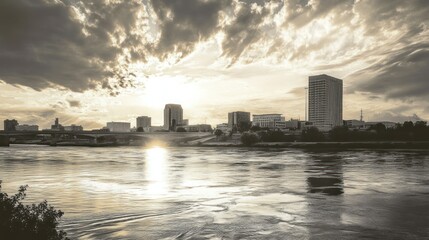 Fototapeta premium Sunset Cityscape over River: A Serene Urban Panorama