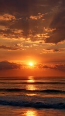 Obraz premium Dramatic Ocean Sunrise with Colorful Clouds and Reflections on Calm Sea Waves