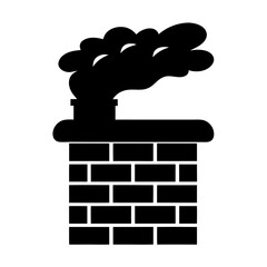 Silhouette of a brick chimney with smoke coming out of it