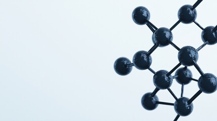 Obraz premium A close-up of a black molecular structure model against a plain light background.