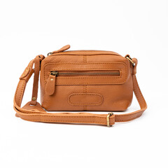 Blank brown leather sling bag for woman isolated on white background, perfect for leather product...